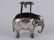 Appraisal: A silver elephant pin cushion with rare howdah frame for