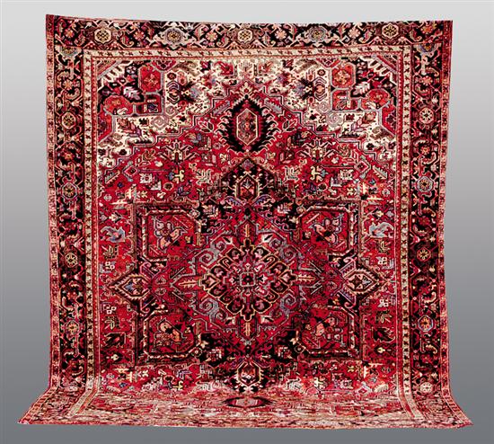 Appraisal: Persian Heriz carpet ' x ' Carpet is - years