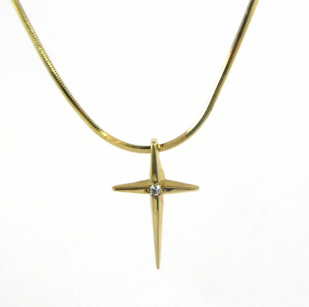 Appraisal: FOURTEEN KARAT GOLD CROSS PENDANT AND CHAIN featuring a small