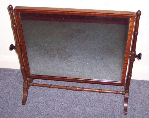 Appraisal: A late th Century swing frame toilet mirror on turned