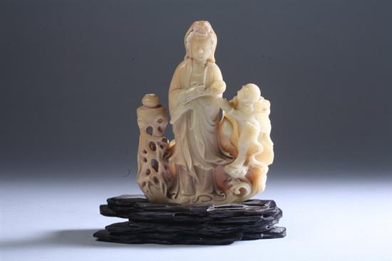 Appraisal: CHINESE SOAPSTONE FIGURE OF GUANYIN AND CHILD - in high