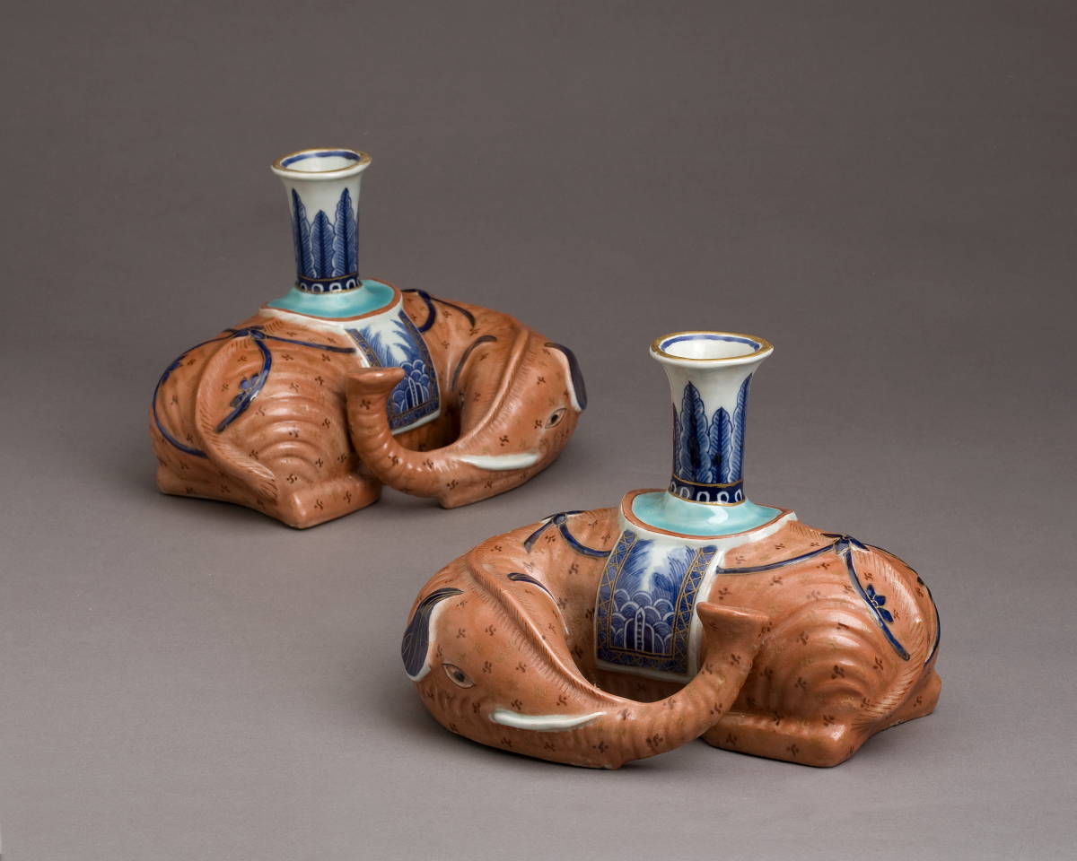 Appraisal: PAIR OF CHINESE EXPORT PORCELAIN RECUMBENT ELEPHANT CANDLESTICKS NINETEENTH CENTURY