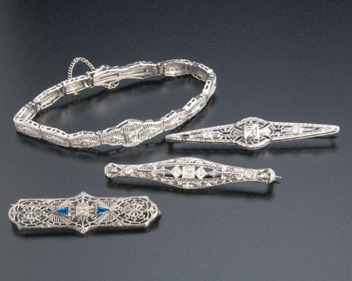 Appraisal: Art Deco diamond filigree jewelry in wg k bracelet with