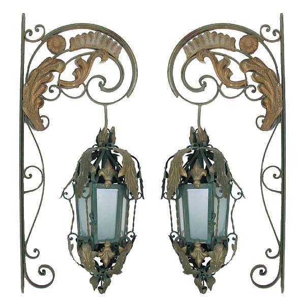 Appraisal: A pair of wrought iron bracketed lanterns height in width