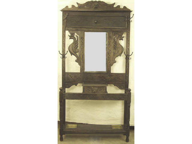 Appraisal: Carved European hall tree with double umbrella stand and center