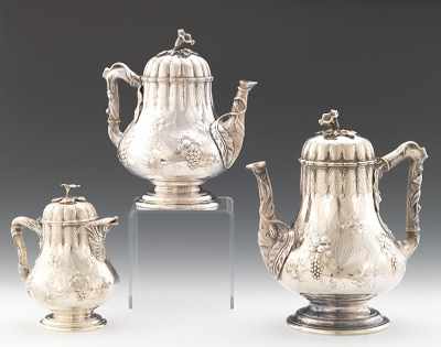 Appraisal: A Three Piece Repousse Coin Silver Coffee Tea Milk Set