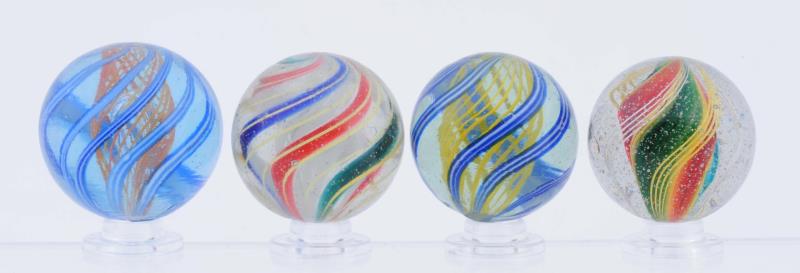 Appraisal: Lot Of Swirl Marbles Lot includes a three stage white