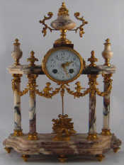 Appraisal: A French day gilt mounted marble mantel clock striking on