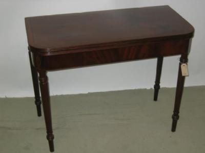 Appraisal: A MAHOGANY FOLDING TEA TABLE the reeded edged rounded oblong