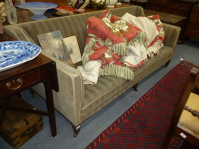 Appraisal: AN EDWARDIAN MAHOGANY GREEN UPHOLSTERED SOFA standing on square legs