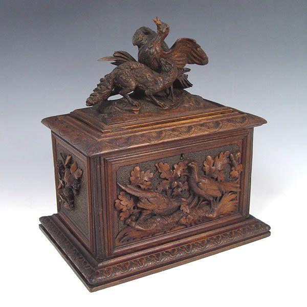 Appraisal: BLACK FOREST CARVED WOOD HUMIDOR Carved and applied decoration including