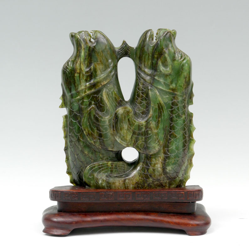 Appraisal: CARVED SERPENTINE FIGURAL GROUP Mirror image figural group of sea