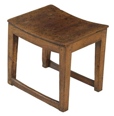 Appraisal: An elm stool the dished seat on square tapering legs