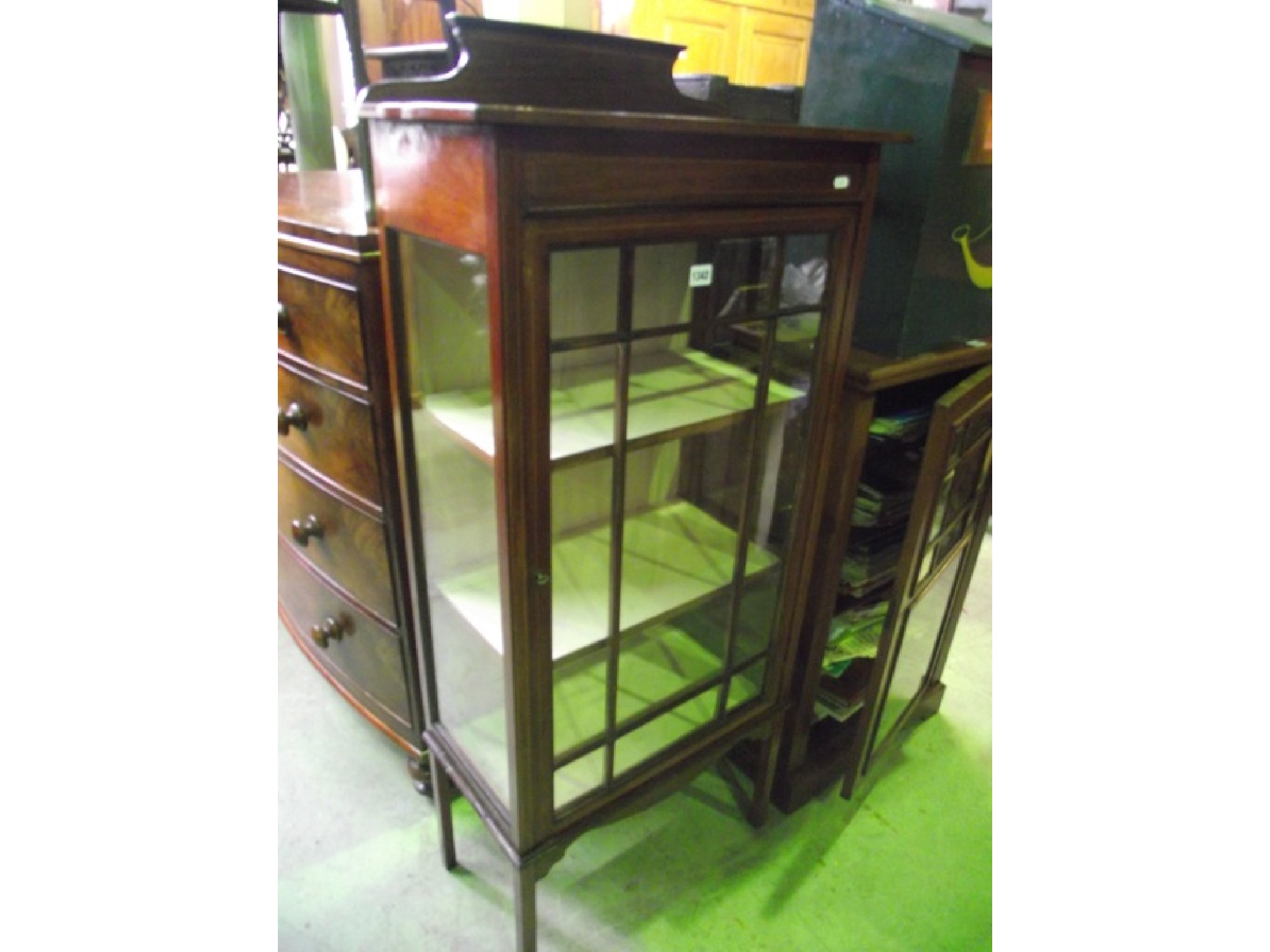 Appraisal: A small freestanding inlaid Edwardian mahogany side display cabinet enclosed