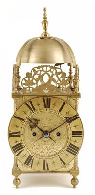 Appraisal: A brass lantern clock with a twin fusee movement striking