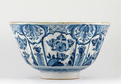 Appraisal: A blue and white fluted Delft bowl painted with six