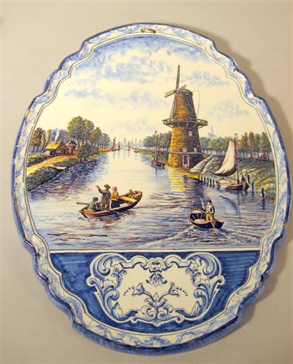 Appraisal: Large Delft painted plaque th century The shield shaped plaque