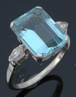 Appraisal: An aquamarine and diamond ring The rectangular cut aquamarine weighing