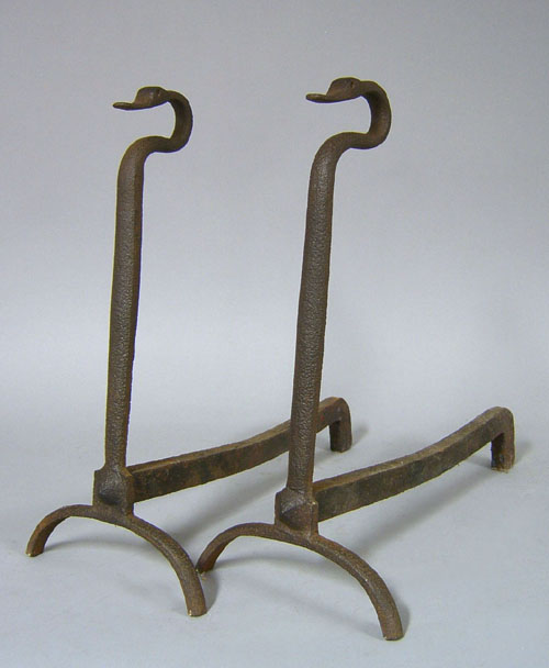 Appraisal: Pair of wrought iron andirons ca with swans neck tops