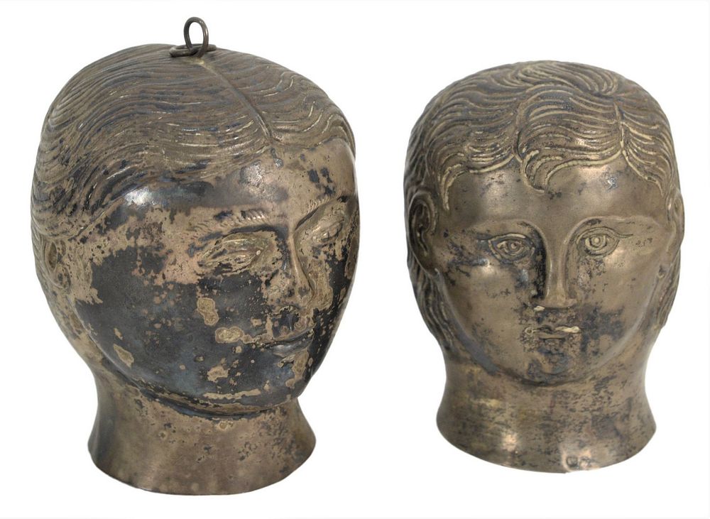 Appraisal: Pair of Silver Heads in the form of a man