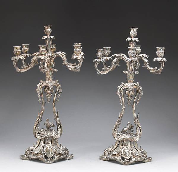 Appraisal: A French plated bronze pair of figural seven light candelabraChristofle