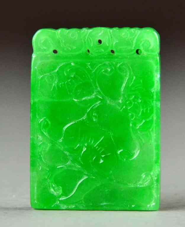 Appraisal: A Fine Chinese Qing Carved Jadeite PendantCarved on both sides