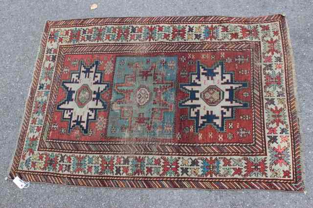 Appraisal: AN ANTIQUE CAUCASIAN SHIRVAN LESGHI RUST GROUND RUG with polychrome