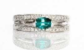 Appraisal: An ct white gold green stone and diamond ring estimated