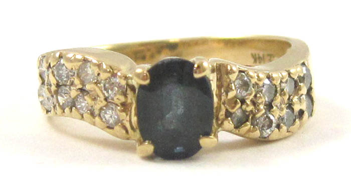 Appraisal: SAPPHIRE DIAMOND AND FOURTEEN KARAT GOLD RING with eight round-cut