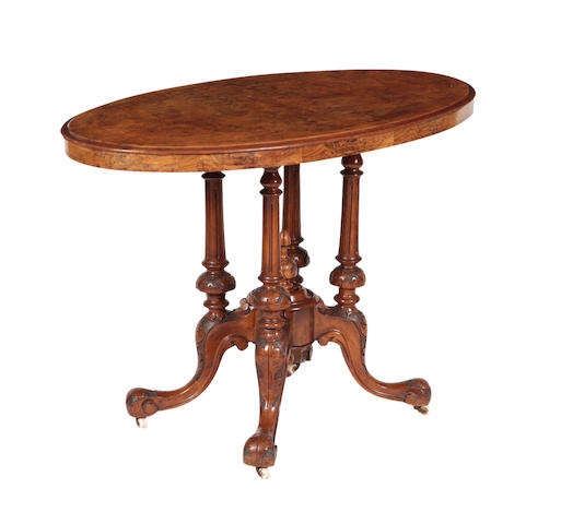 Appraisal: A Victorian figured walnut centre table The oval top with