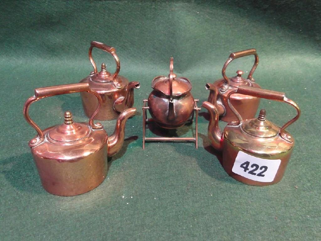 Appraisal: A collection of three miniature th century copper kettles one