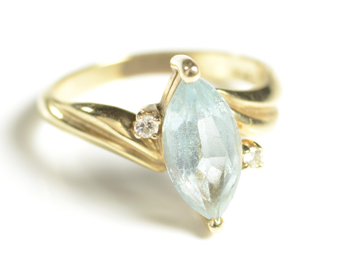 Appraisal: BLUE TOPAZ AND DIAMOND RING k yellow gold with two