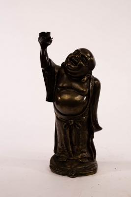 Appraisal: A Japanese brass lamp base modelled as Putai his arm