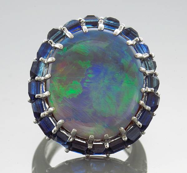 Appraisal: An opal sapphire and diamond ring an oval-shaped opal cabochon