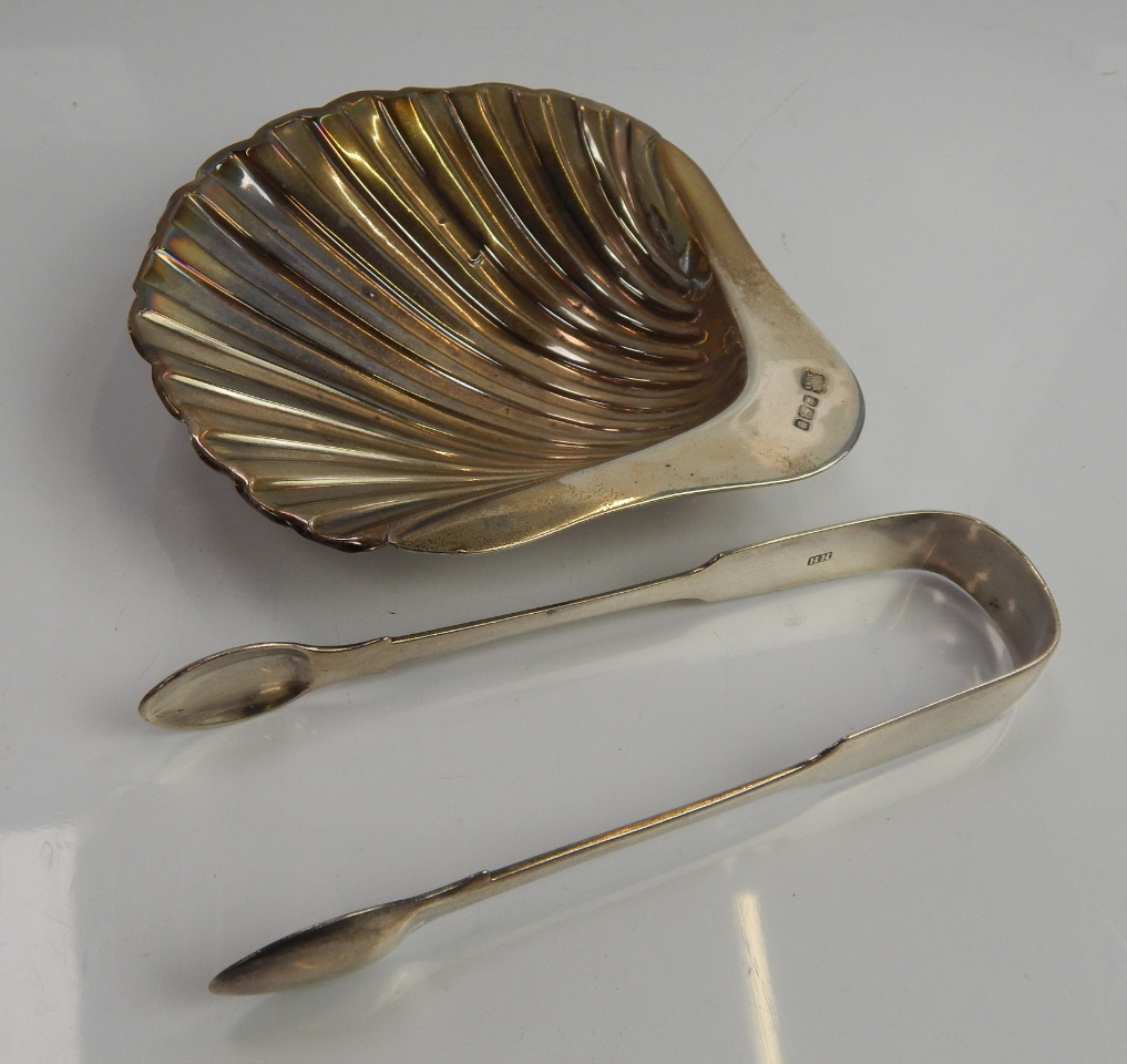 Appraisal: A late Edwardian silver butter dish of scallop shell design