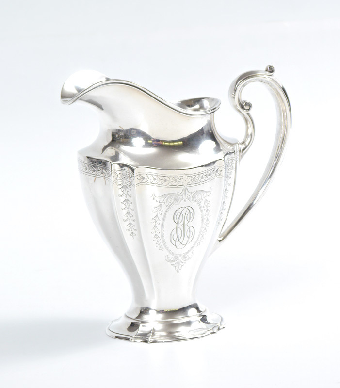 Appraisal: REED BARTON STERLING SILVER WATER PITCHER Fluted sides engraved foliate