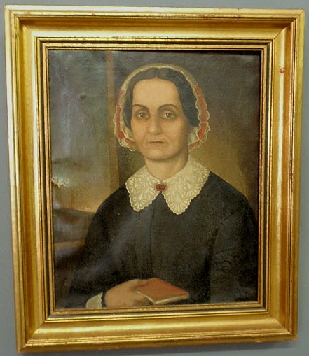 Appraisal: Oil on canvas portrait of a woman holding a book