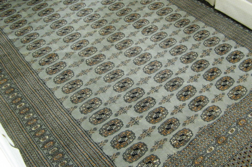 Appraisal: BOKHARA CARPET hand knotted in a pattern of repeating columns