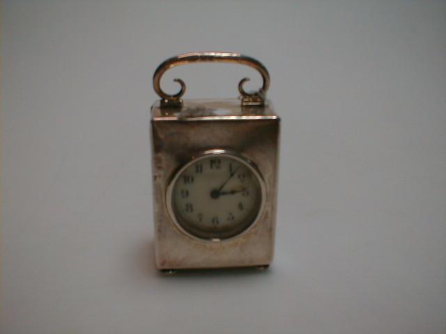 Appraisal: An Edward VII silver miniature table clock with a timepiece