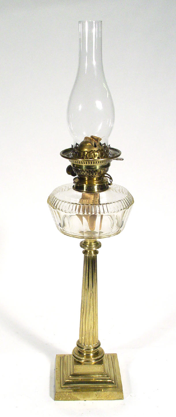 Appraisal: Cut glass oil lamp on reeded brass stem and square