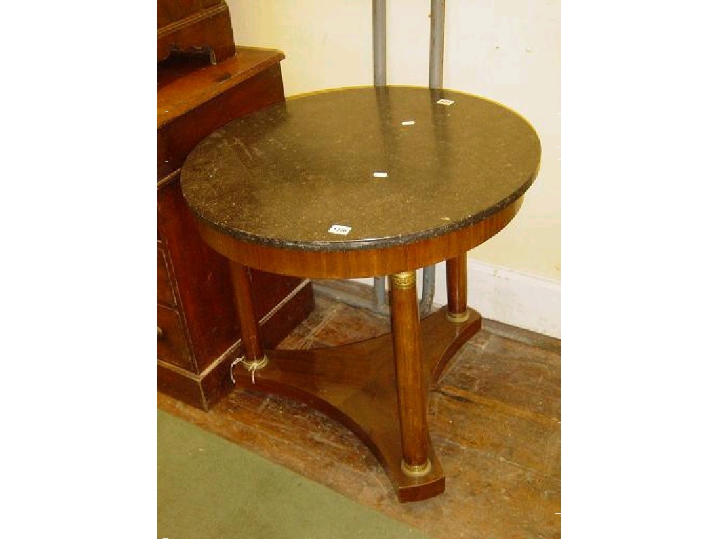 Appraisal: A reproduction Empire style occasional table of circular form raised