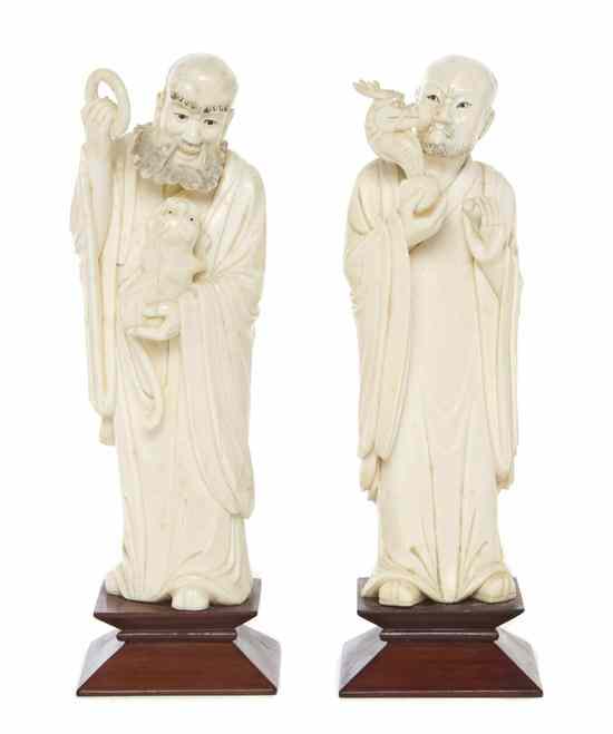 Appraisal: A Pair of Chinese Carved Ivory Figures of Immortals one