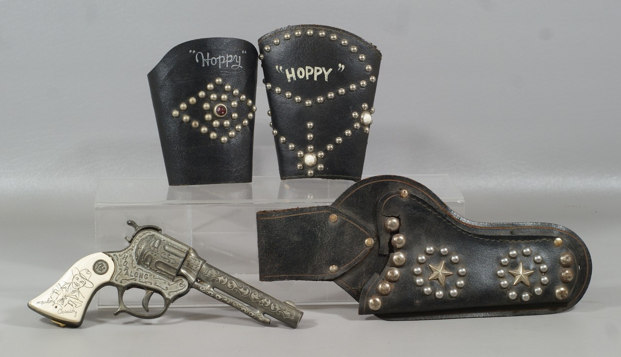 Appraisal: Hopalong Cassidy non-matching leather wrist cuffs holster with losses and