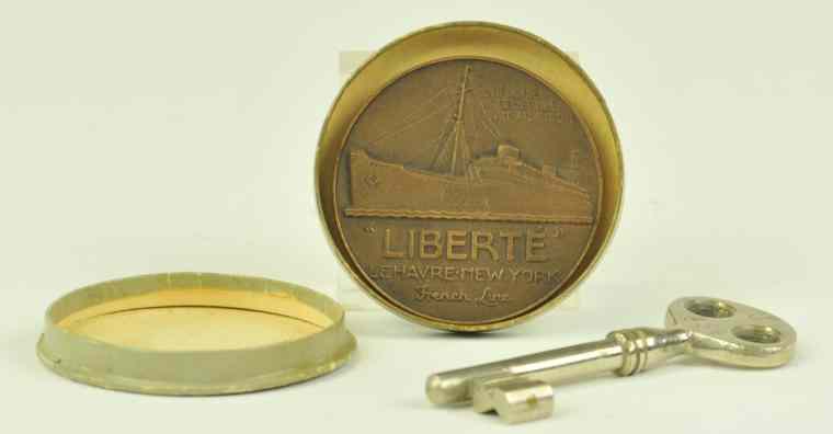 Appraisal: LIBERTE SOUVENIR COIN AND KEY Well molded large coin piece