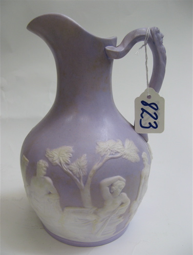 Appraisal: AN ENGLISH JASPERWARE PITCHER raised white classical figures on lavender