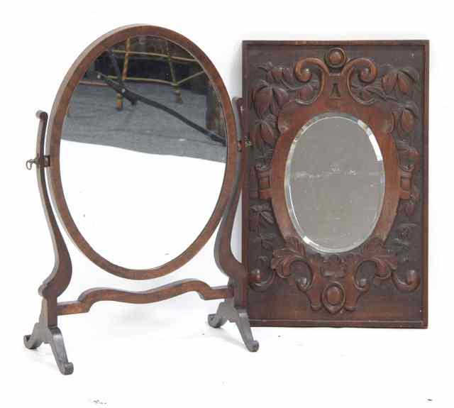 Appraisal: A mahogany swing frame mirror and a mirror with carved