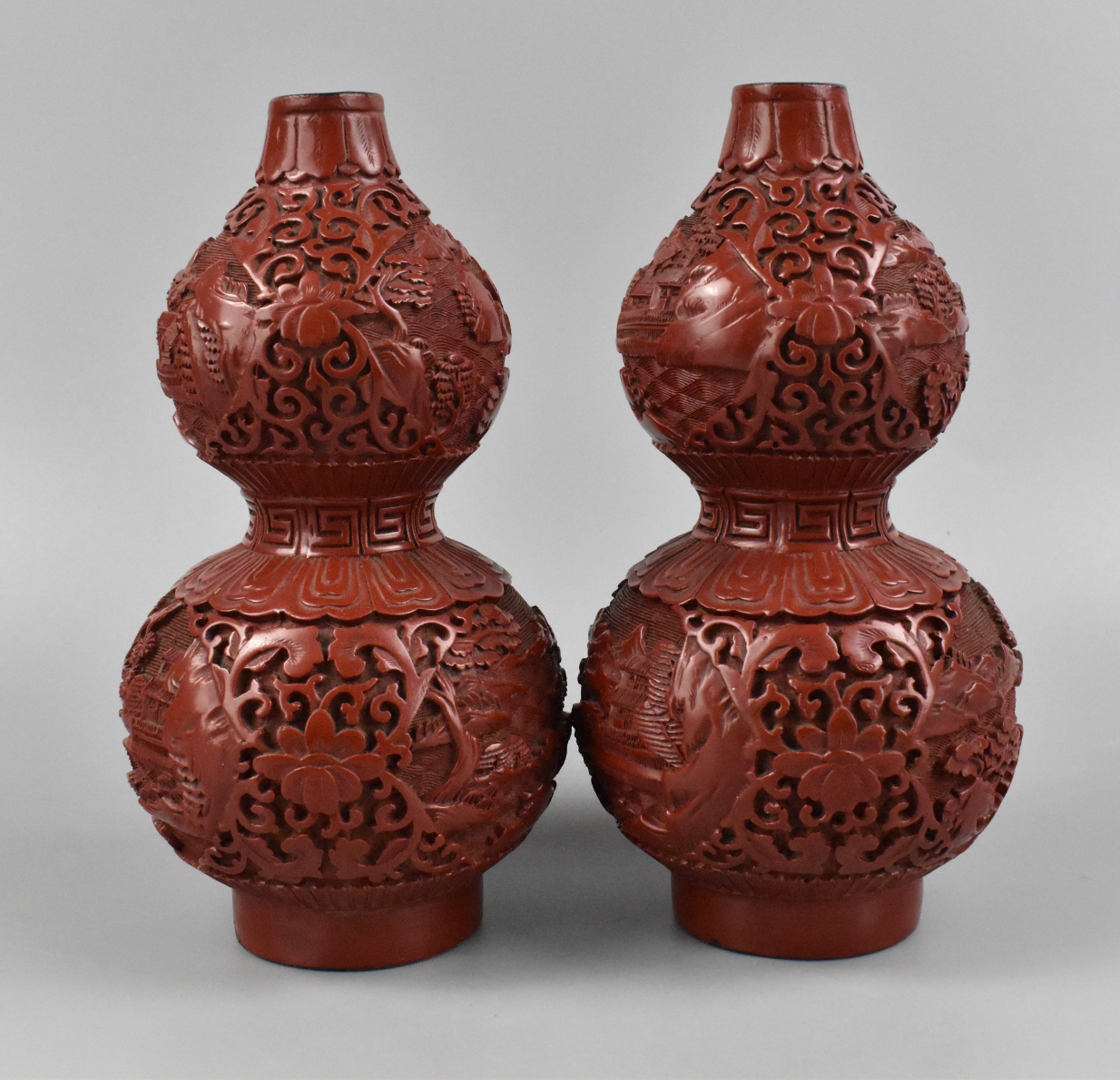 Appraisal: A pair of Chinese red lacquered gourd shaped vases Each