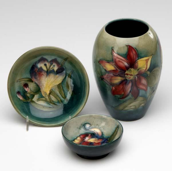 Appraisal: MOORCROFT Three pieces with flowers on a pale green ground