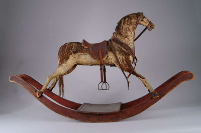 Appraisal: CHILD'S RIDE ON ROCKING HORSE th century rocker with glass