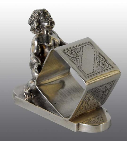 Appraisal: Nude Boy Holding Figural Napkin Ring Description Tufts No damage